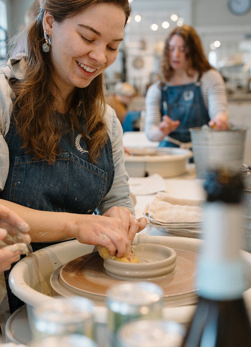 Woman working with clay in a pottery studio