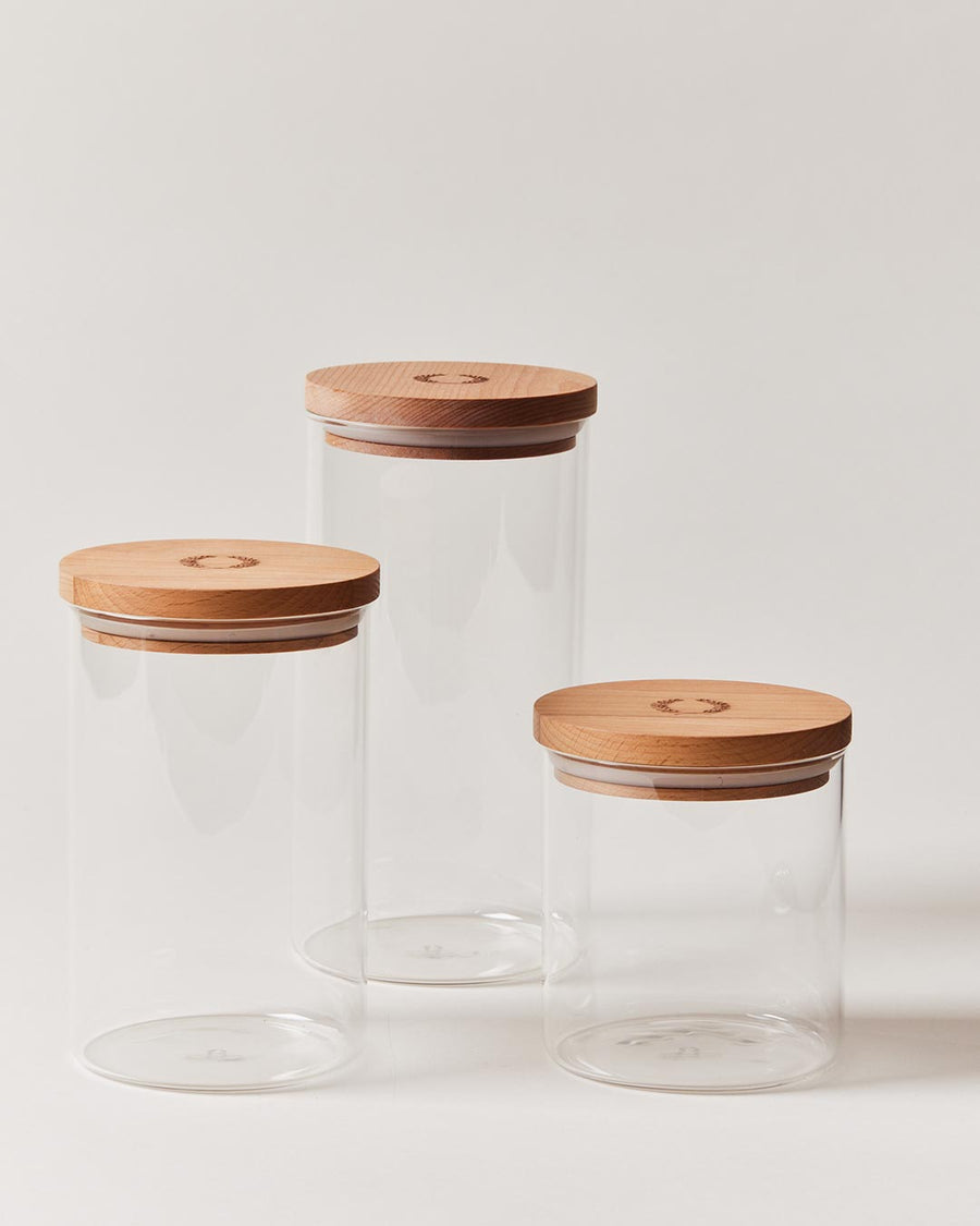 https://www.farmhousepottery.com/cdn/shop/products/canister-with-wooden-lid-group-empty.jpg?v=1662620819&width=900