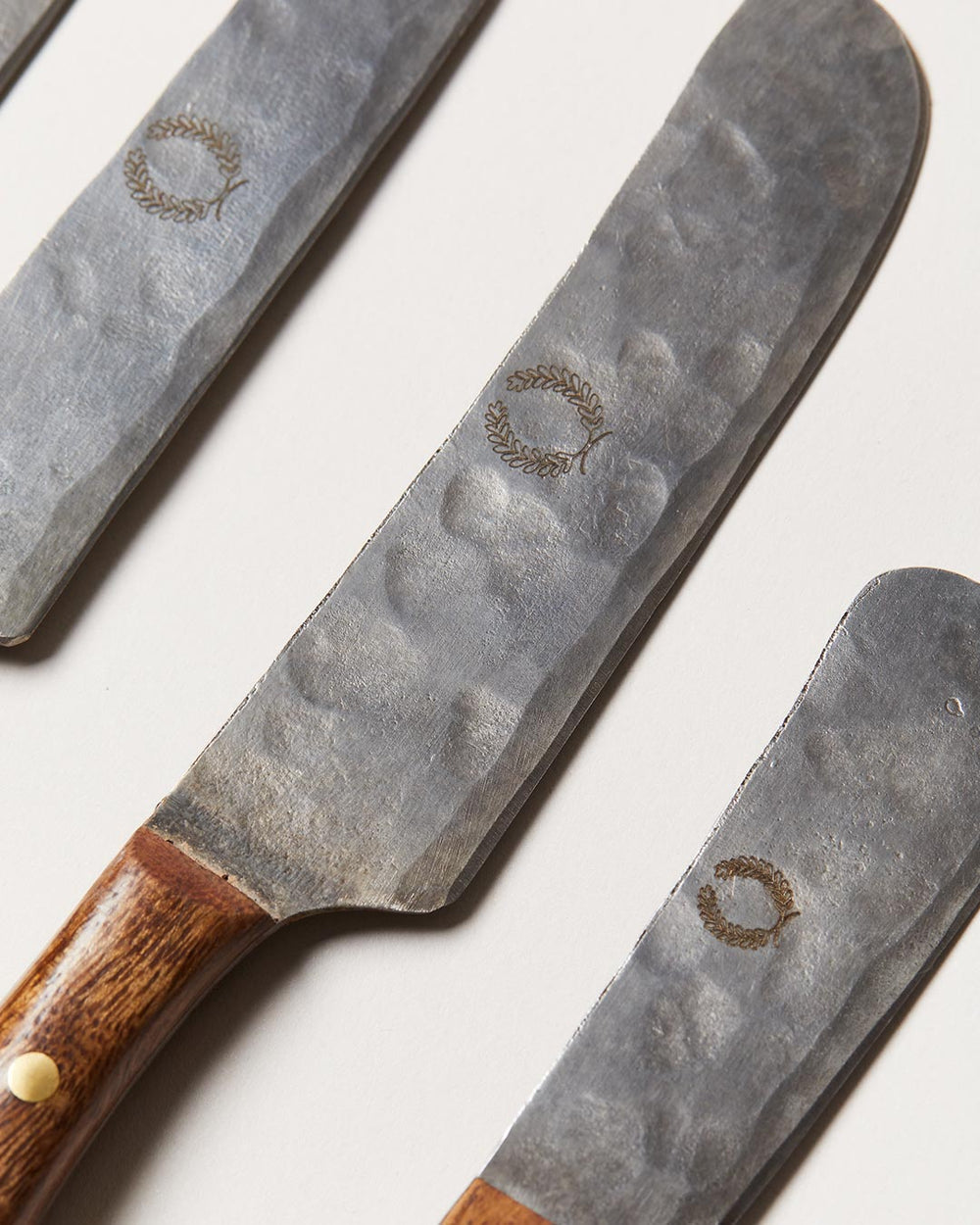 https://www.farmhousepottery.com/cdn/shop/products/forged-cheese-knives-detail.jpg?v=1680117382&width=1000